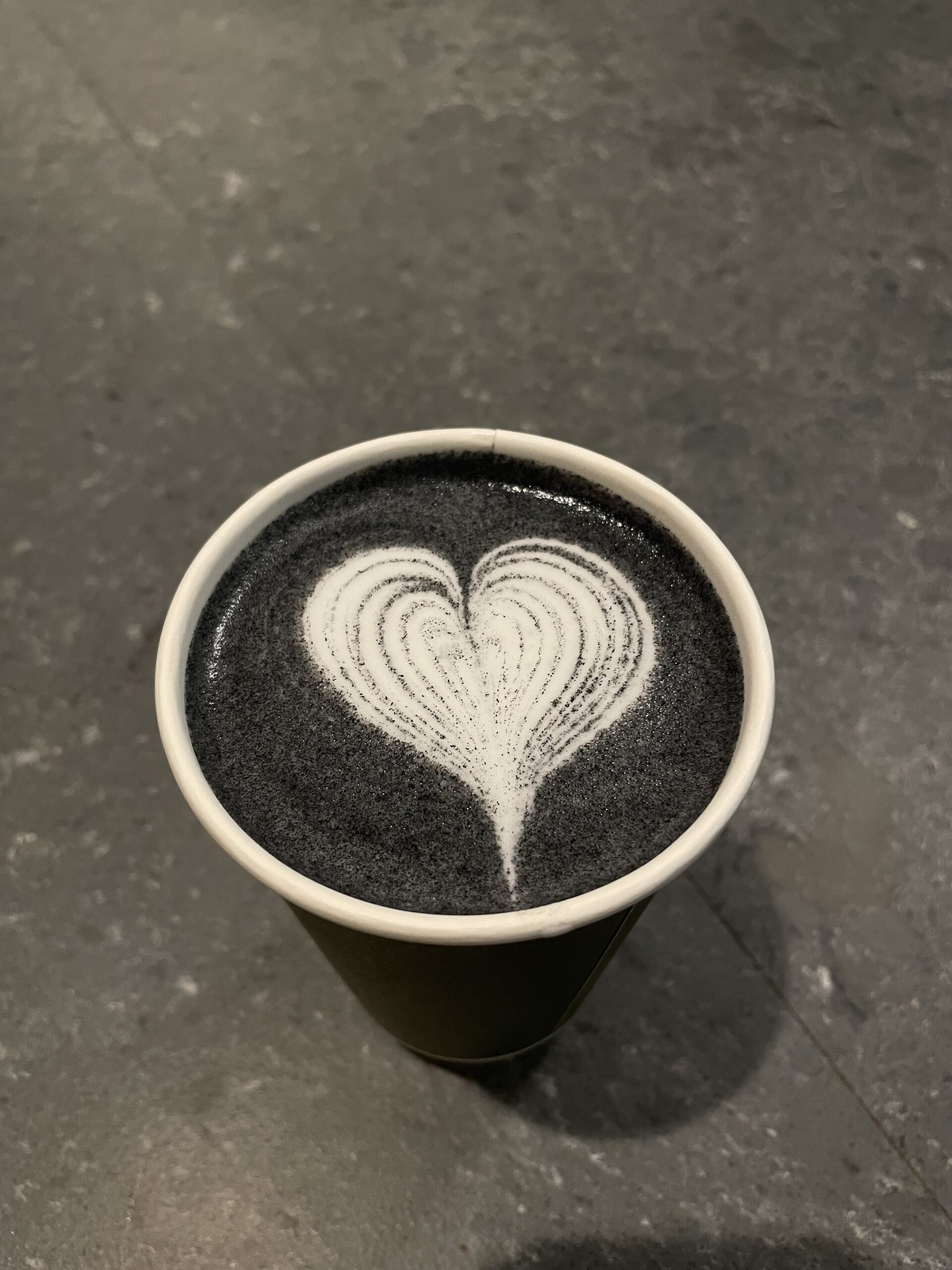 Latte with heart drawing at the top of it.